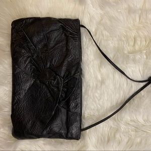 Black oversized leather clutch
